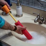 Many people rely on chemical solutions to unclog bathroom sinks as a quick fix, but many more practical and non-corrosive ways solve the problem.